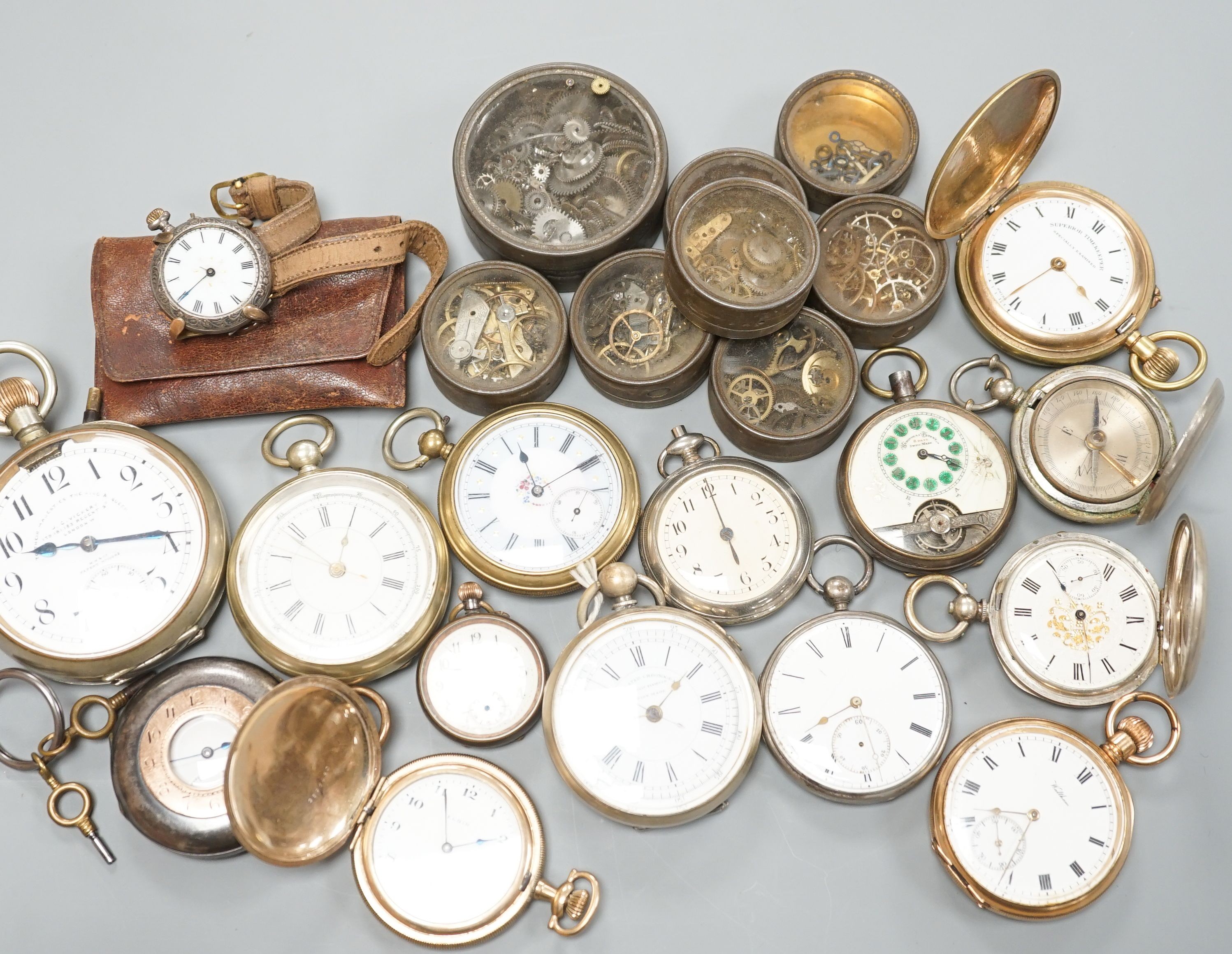 A small collection of assorted base metal and gold plated pocket watches including Hebdomas and Waltham and a small quantity of watch parts.